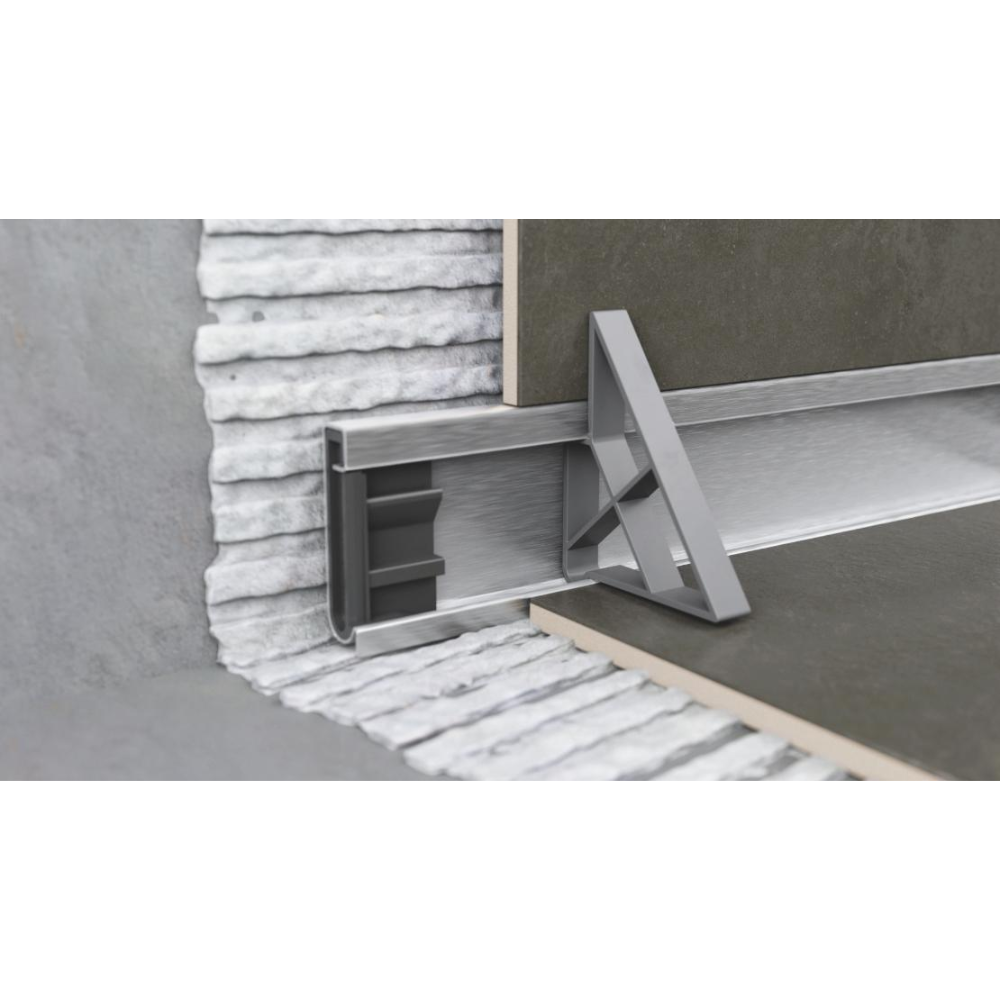 Detailed image of Gruen WallLine drain body and adjustable end cap for custom cutting and installation precision