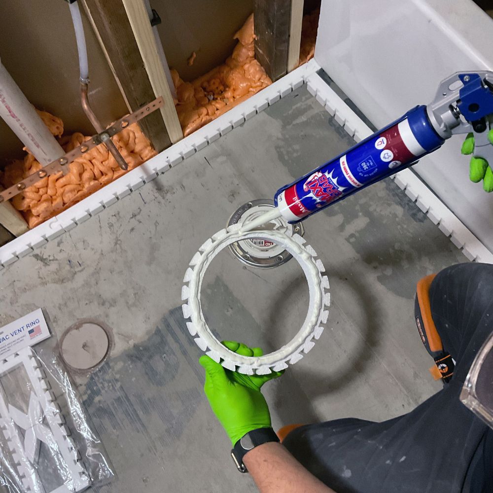 Leak-proof foam barrier for bathroom flooring