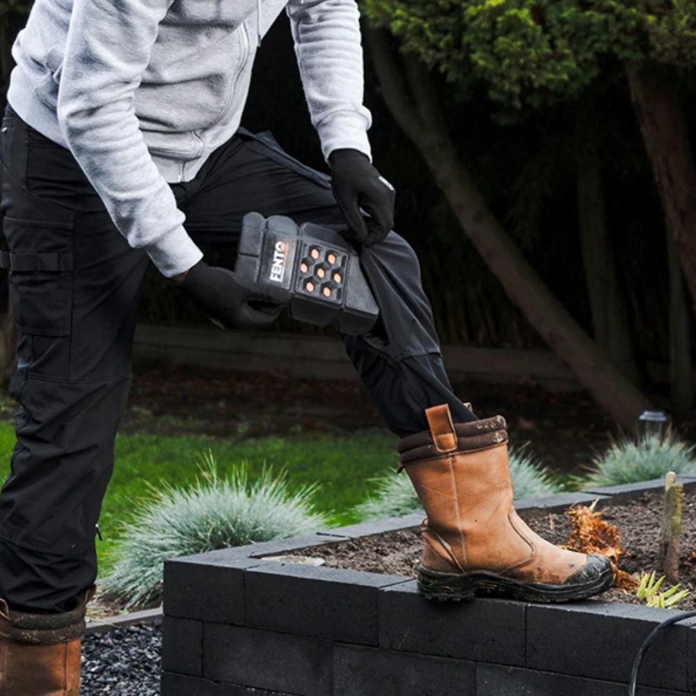 FENTO POCKET M2 being inserted in work trouser kneepad pocket