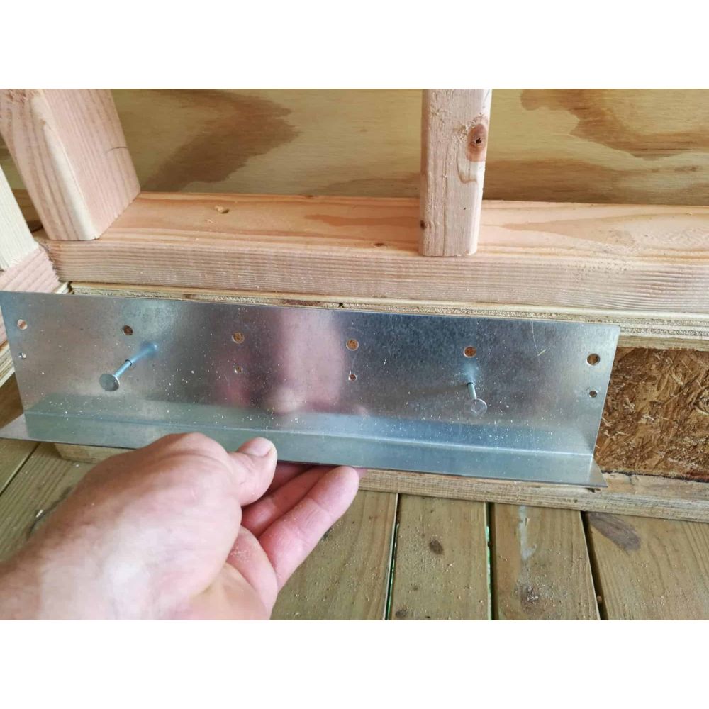 Installer fitting Rapid Recess L Bracket in stud wall