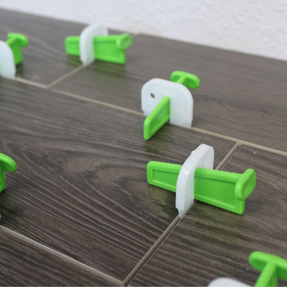 MLT Space & Break Wedge tile leveling system being used on a  tile installation